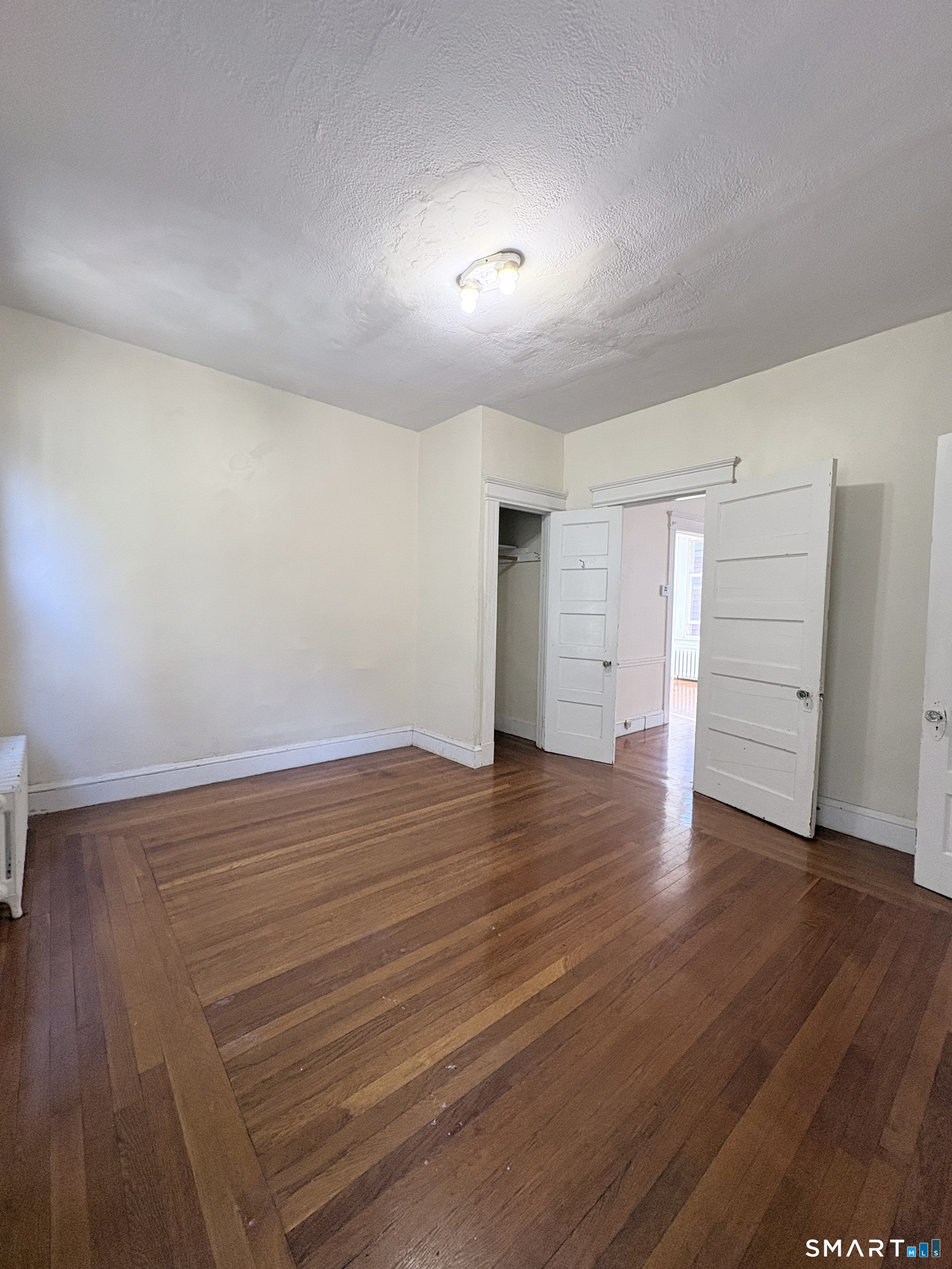 787 Elm Street, Unit 2 New Haven, CT 06511 - Photo 10 of 16 a view of empty room with wooden floor