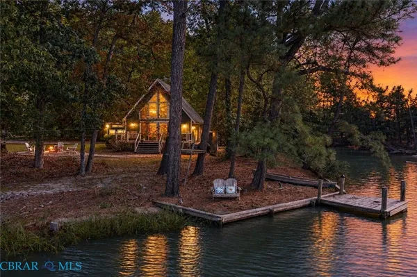 a view of a lake with a house in the background