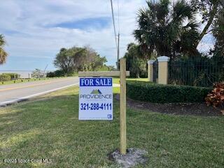 5205 South Tropical Trail Merritt Island, FL 32952 - Photo 5 of 6 a sign on the side of the road