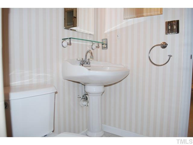 7220 Paddock Drive Raleigh, NC 27613 - Photo 8 of 10 Tastefully updated master bath with pedastal sink.