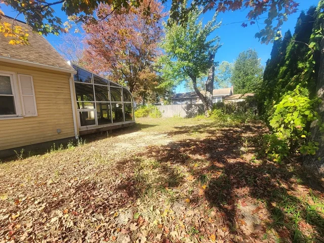 a view of a house with a yard