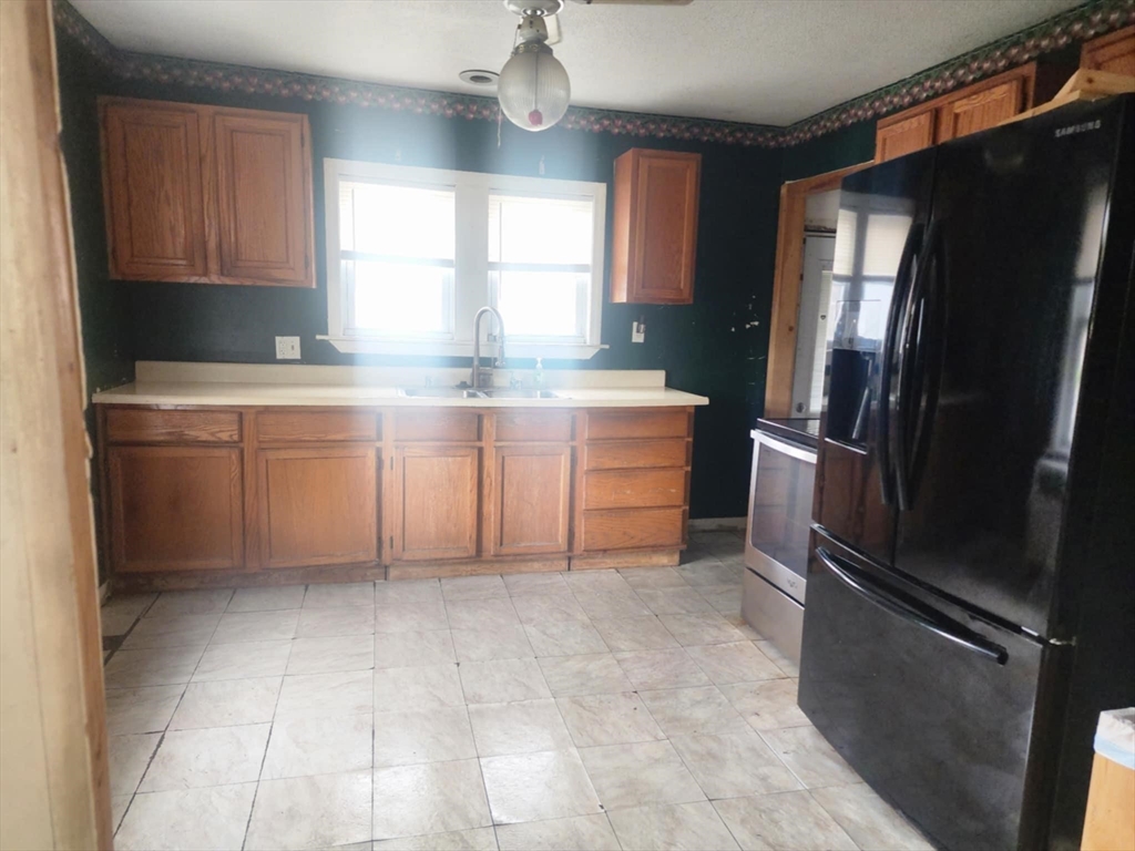 2 Alice Street Montague, MA 01376 - Photo 9 of 18 a kitchen with stainless steel appliances a refrigerator sink and cabinets