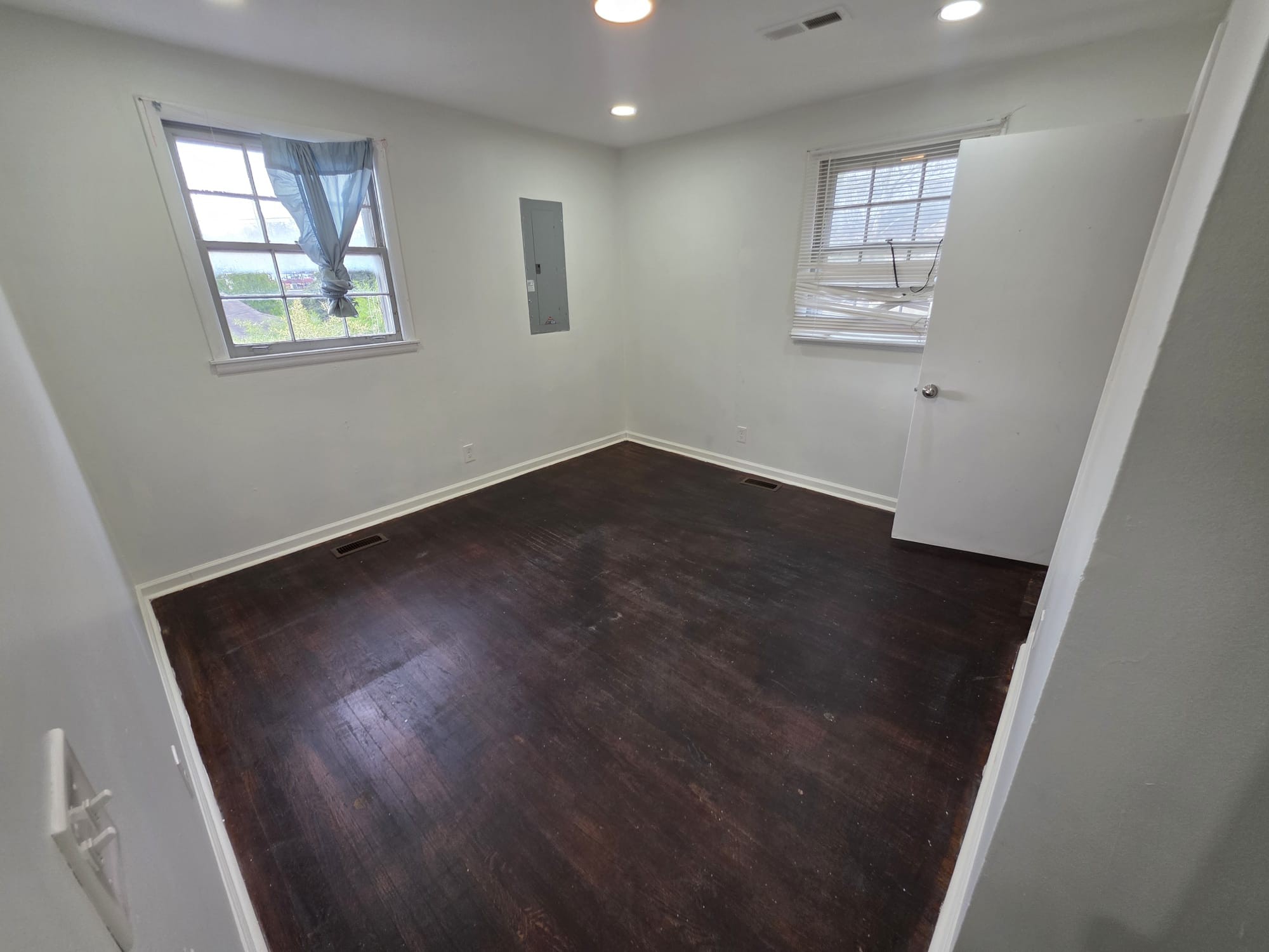 353 Elysian Fields Road, Unit A Nashville, TN 37211 - Photo 12 of 16 a view of an empty room with wooden floor and a window