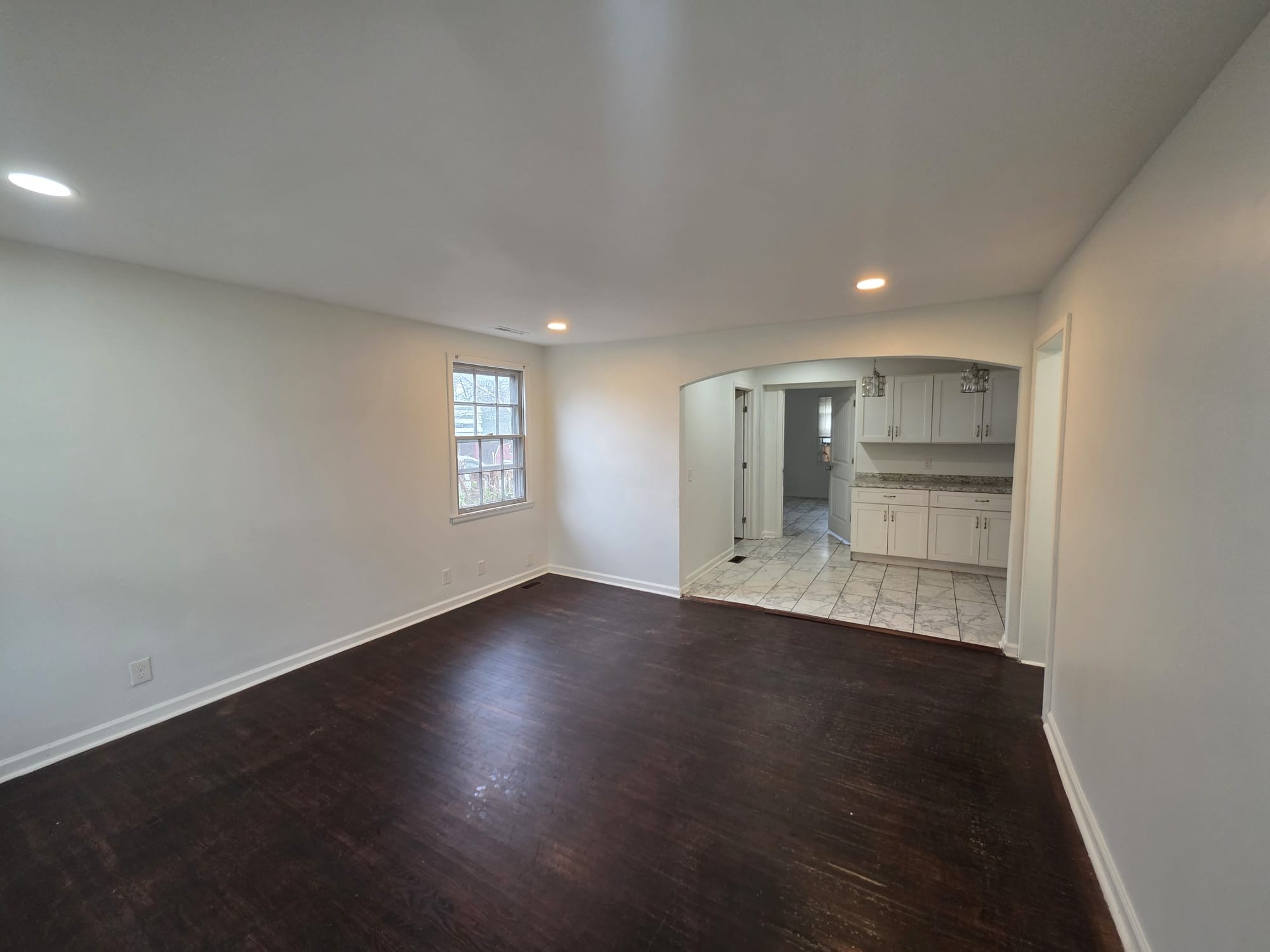 353 Elysian Fields Road, Unit A Nashville, TN 37211 - Photo 15 of 16 an empty room with wooden floor and window