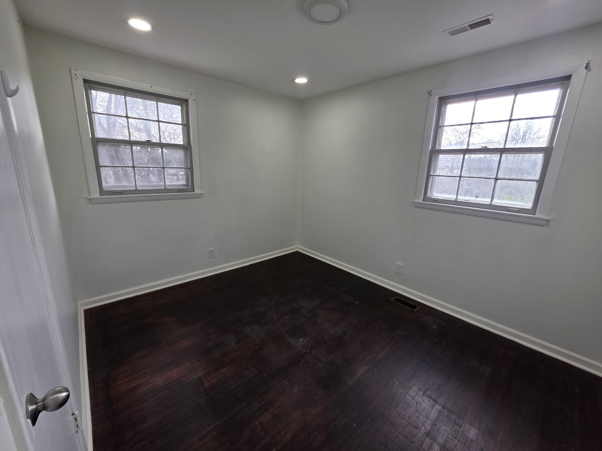 353 Elysian Fields Road, Unit A Nashville, TN 37211 - Photo 3 of 16 an empty room with wooden floor and windows