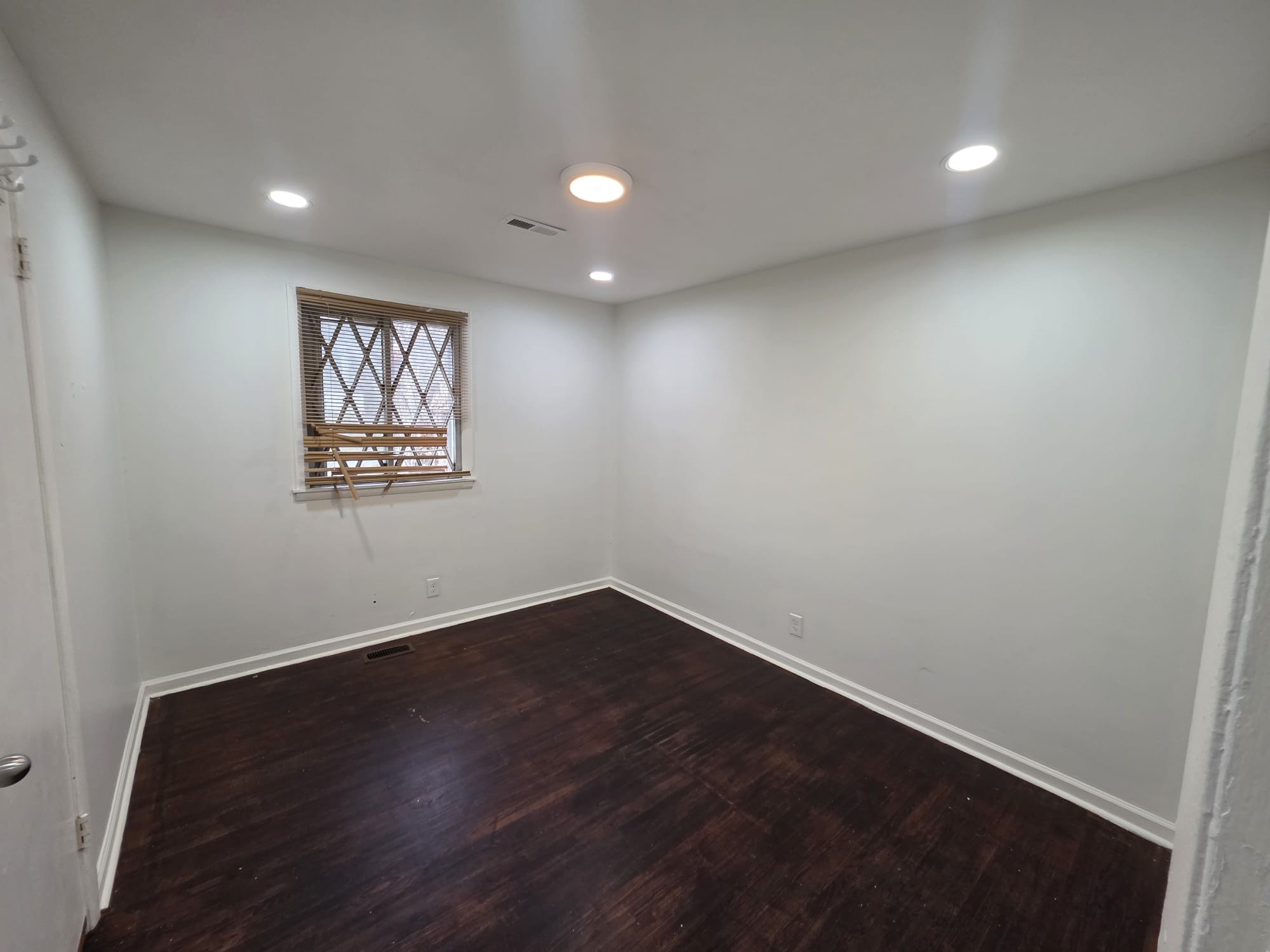 353 Elysian Fields Road, Unit A Nashville, TN 37211 - Photo 9 of 16 an empty room with wooden floor and windows