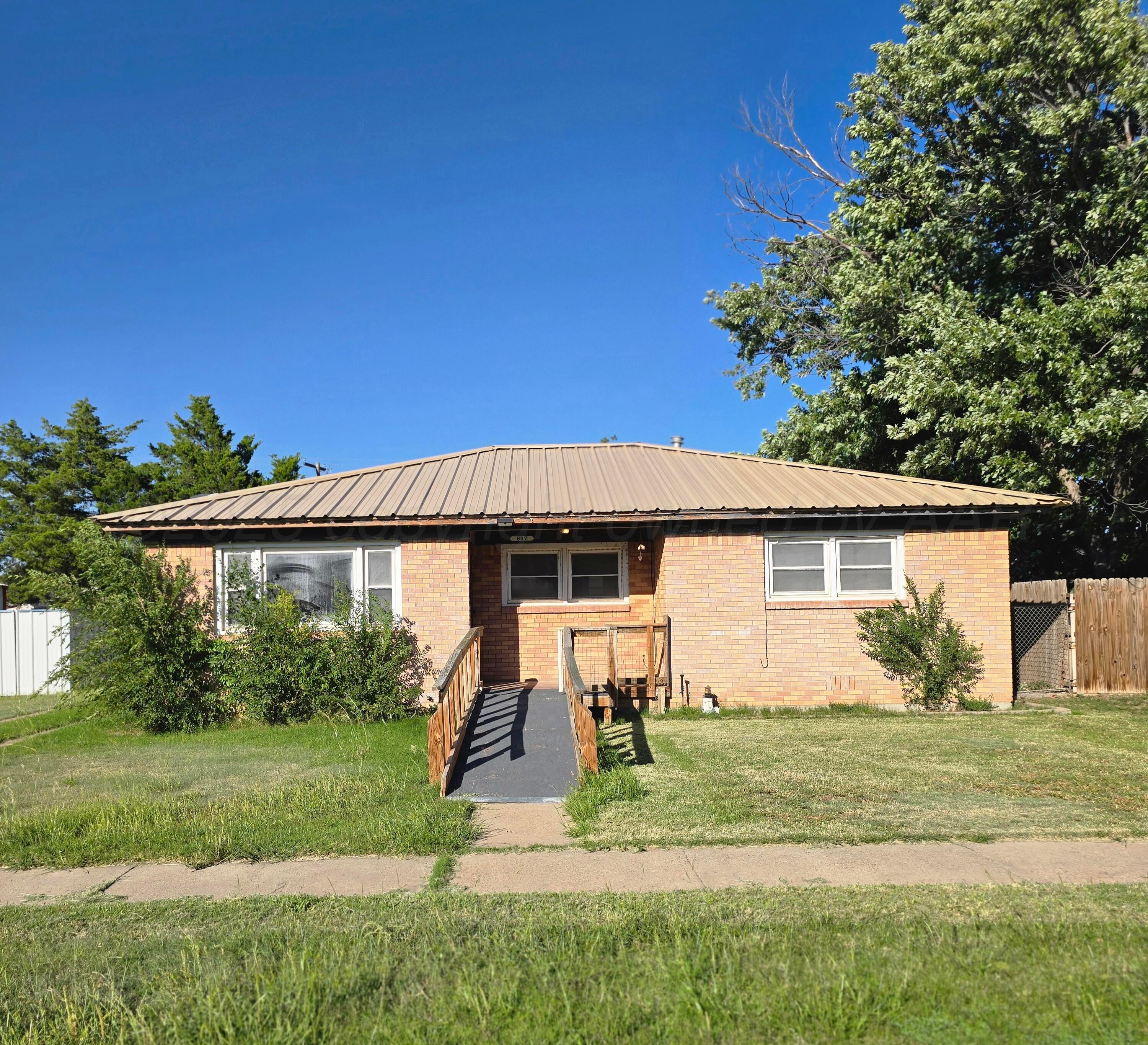 front view of a house with a yard