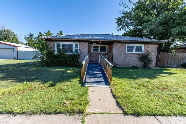 a front view of a house with yard