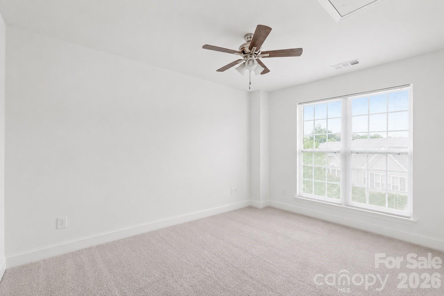 1707 Kashmir White Lane Fort Mill, SC 29708 - Photo 24 of 33 a view of a livingroom with a ceiling fan and window