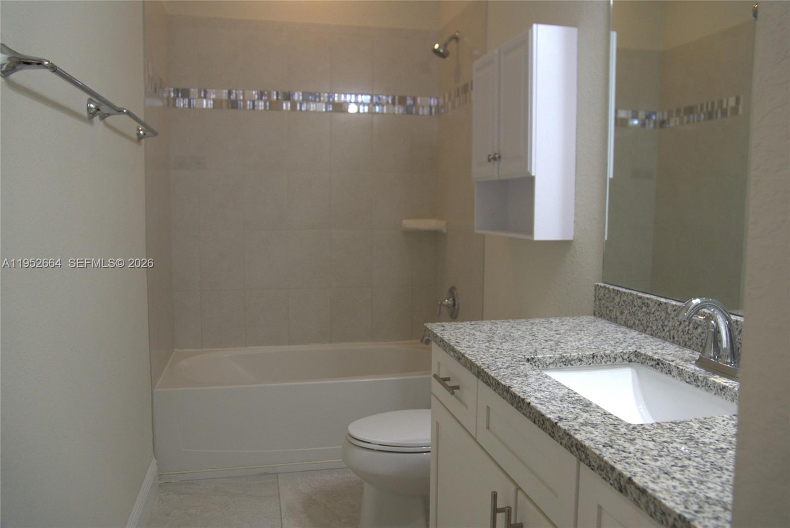 3917 Mahogany Lane Hollywood, FL 33021 - Photo 12 of 16 a bathroom with a granite countertop sink a toilet and shower