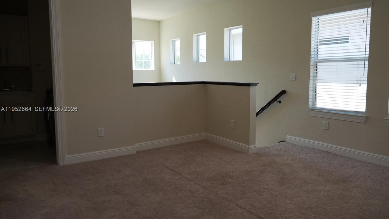 3917 Mahogany Lane Hollywood, FL 33021 - Photo 10 of 16 an empty room that has a window in it