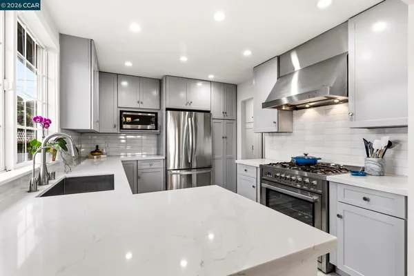 a kitchen with sink cabinets and wooden floor