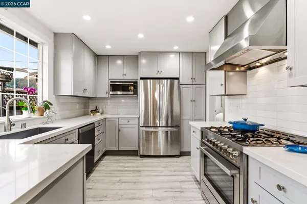 a kitchen with a sink and a window