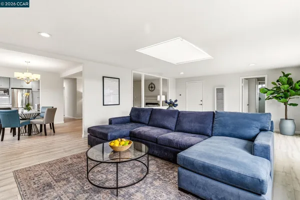 a view of living room with furniture and a flat screen tv