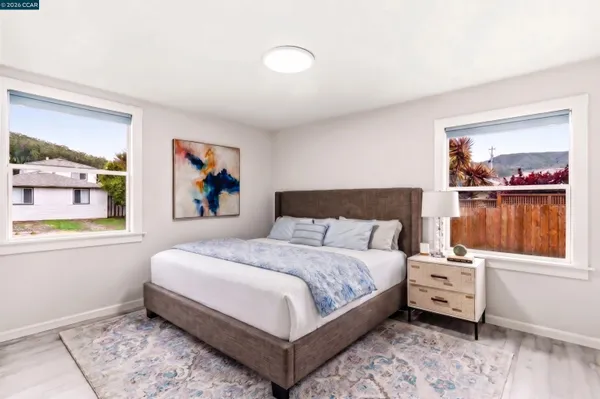 a bedroom with furniture and a window