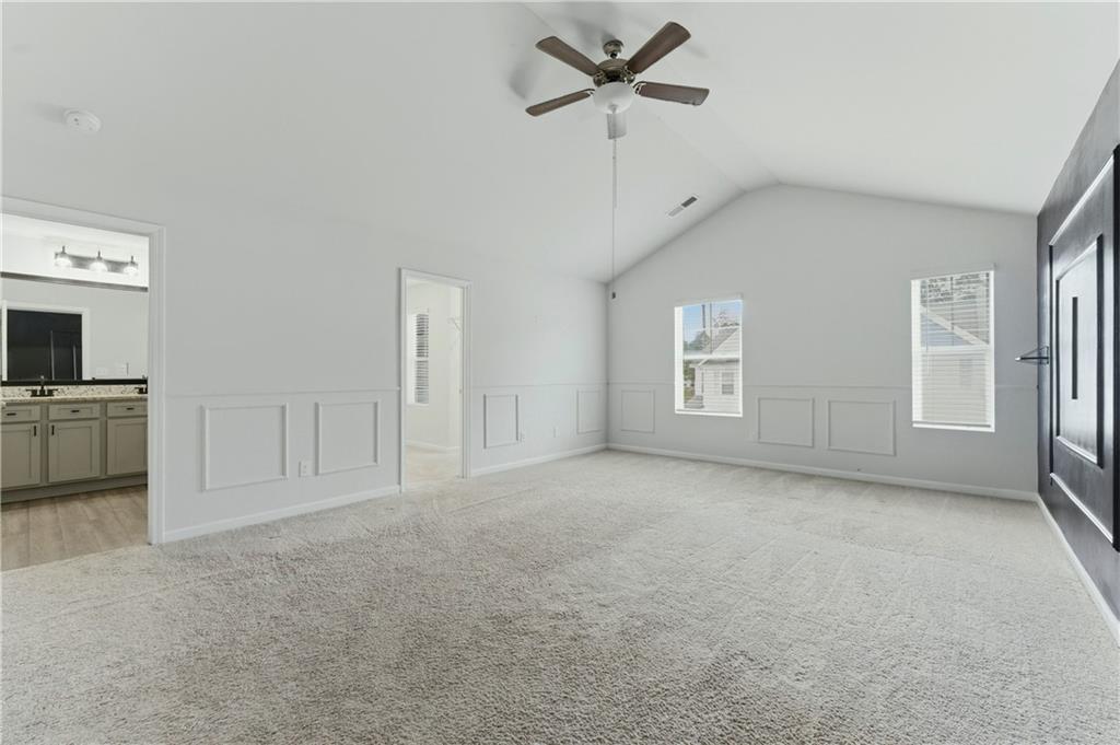 7492 Knoll Hollow Road Lithonia, GA 30058 - Photo 17 of 30 a view of an empty room with a window