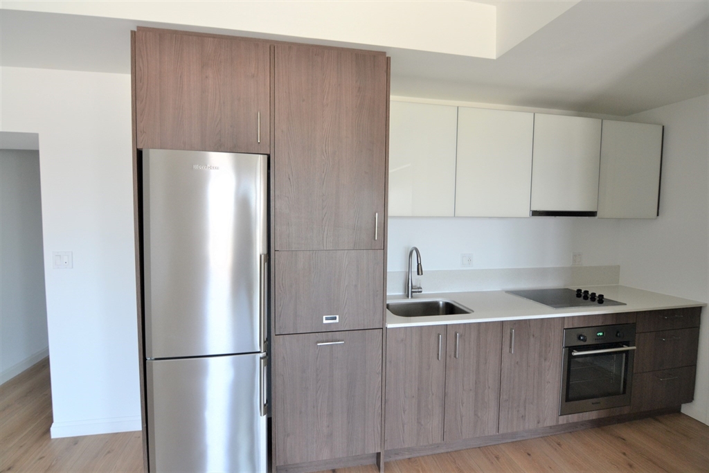1282 Boylston Street, Unit 725 Boston, MA 02215 - Photo 12 of 18 a kitchen with stainless steel appliances granite countertop a refrigerator a sink and a stove