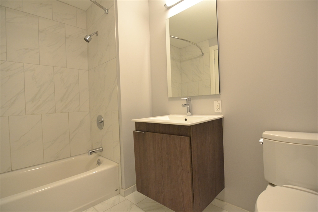1282 Boylston Street, Unit 725 Boston, MA 02215 - Photo 13 of 18 a bathroom with a sink toilet and shower