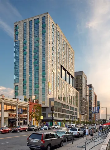 a city street lined with buildings and cars