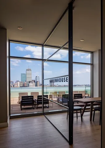 a view of a room with lots of furniture and window