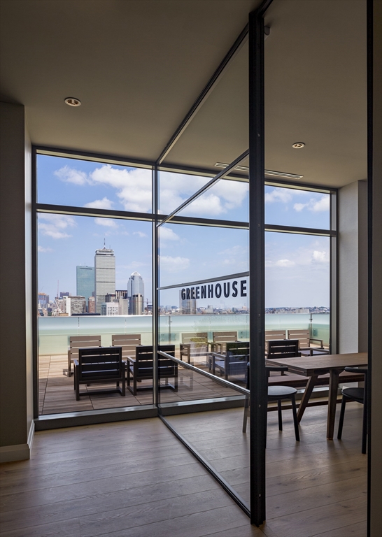 1282 Boylston Street, Unit 725 Boston, MA 02215 - Photo 7 of 18 a view of a room with lots of furniture and window