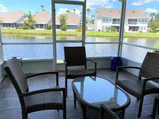 a front view of a house with a garden and trees