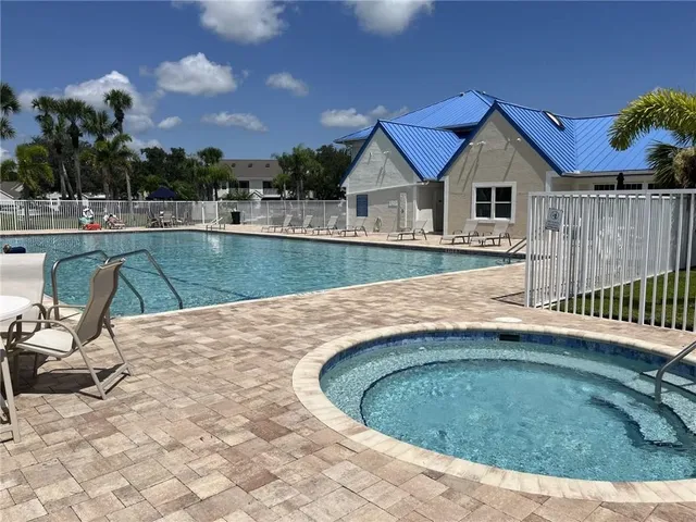 a view of a swimming pool and a yard