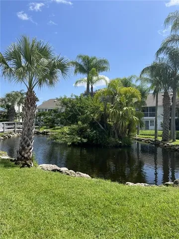 a room with gym equipment and a view of living room