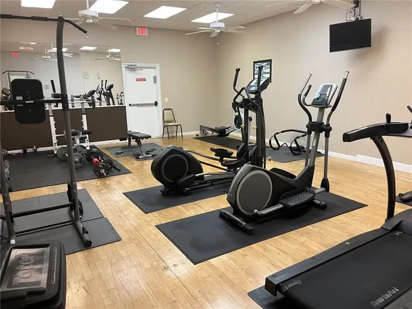 a living room with furniture and a book shelf