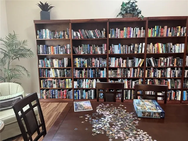 a view of a dining room with furniture and window