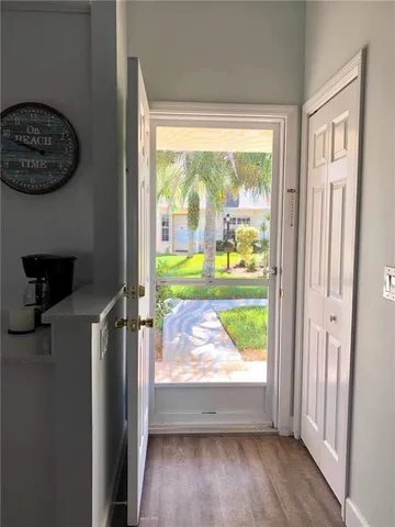 a kitchen with stainless steel appliances granite countertop a stove top oven a sink and a microwave