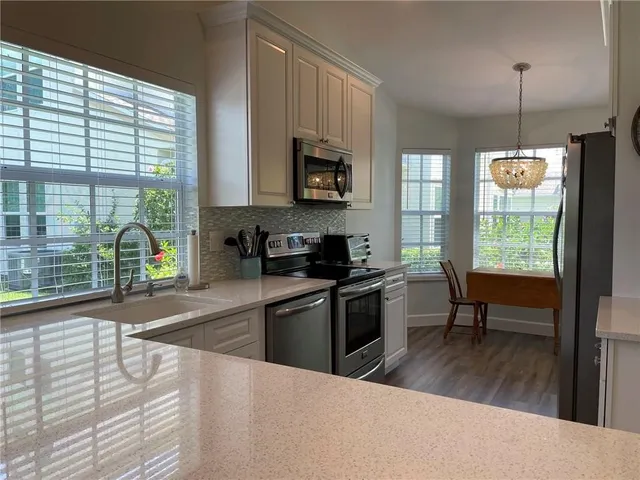 a room with furniture and a chandelier