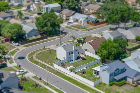 an aerial view of a house with a swimming pool