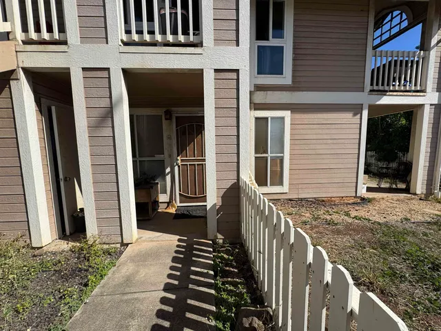 a view of a house with more windows and brick walls