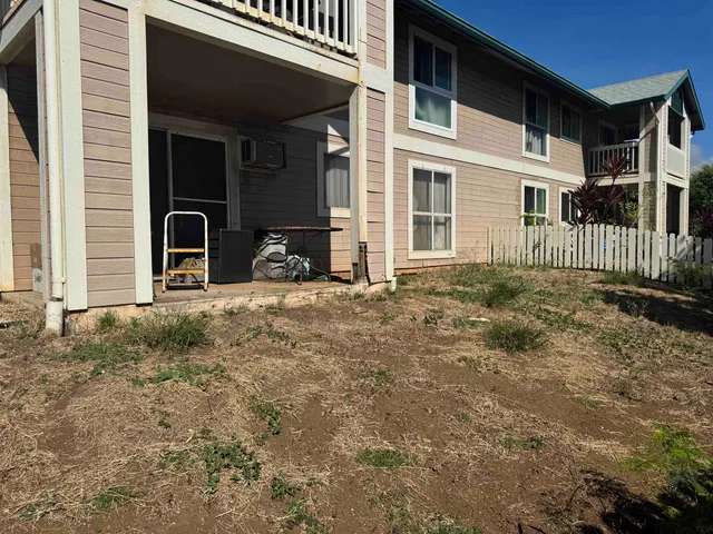 a view of a house with backyard of the house