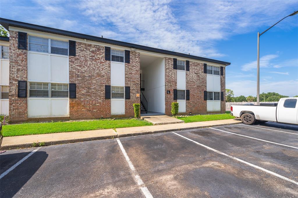 a view of a building with a yard
