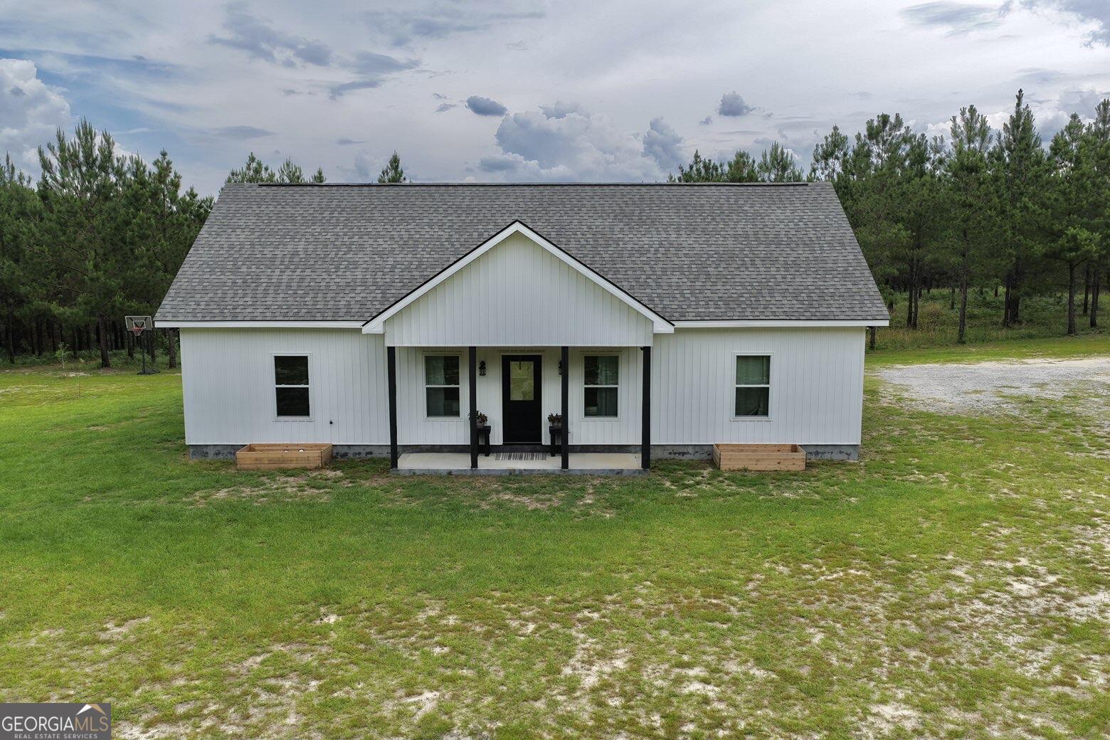 210 St Galilee Road Swainsboro, GA 30401 - Photo 2 of 18 a house view with a garden space