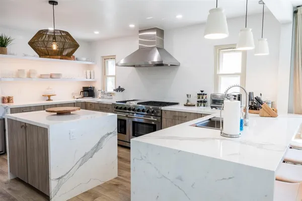 a kitchen with a stove and a sink