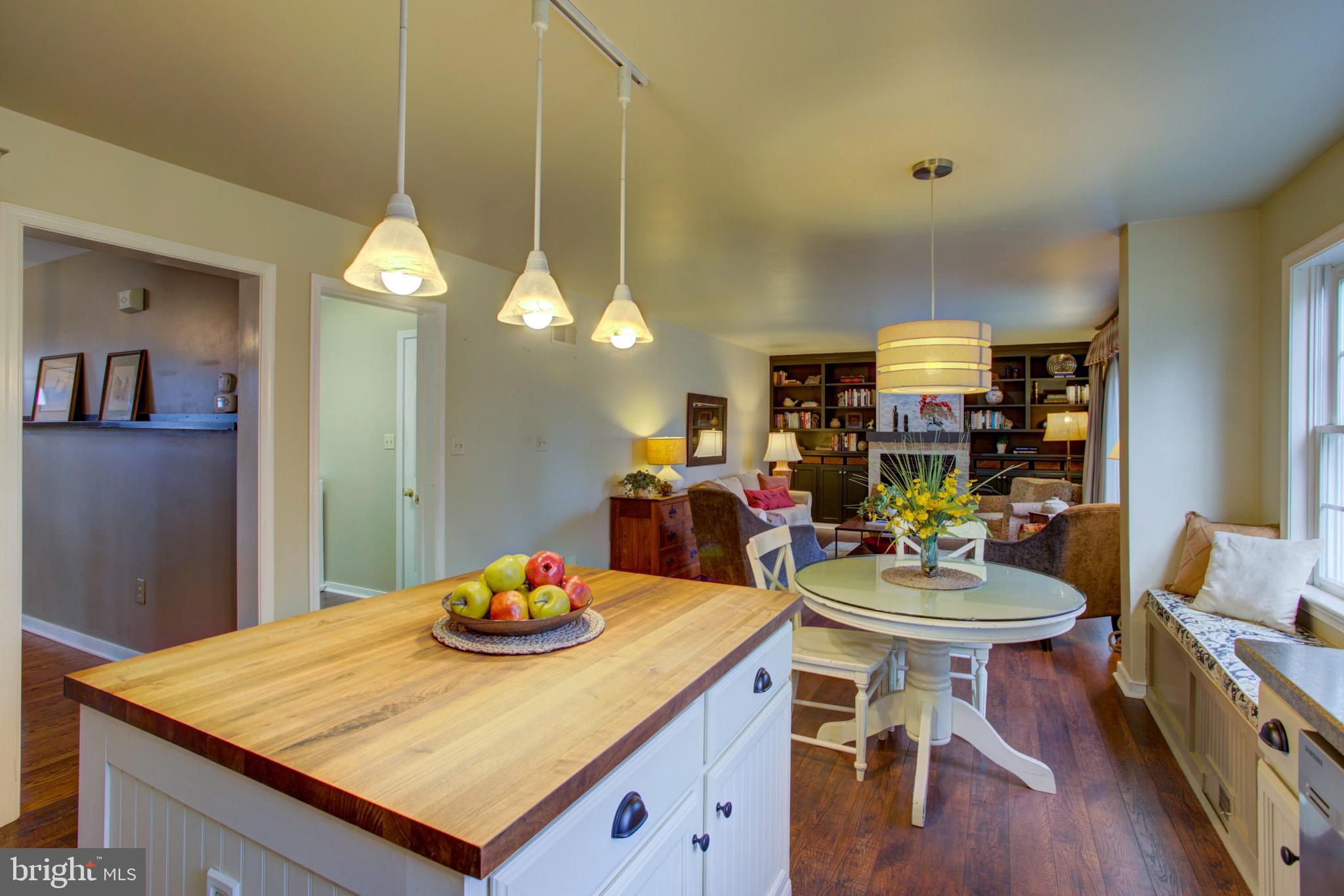 239 Kingsbridge Drive Lititz, PA 17543 - Photo 12 of 37 a view of a dining room and livingroom with furniture wooden floor and a chandelier