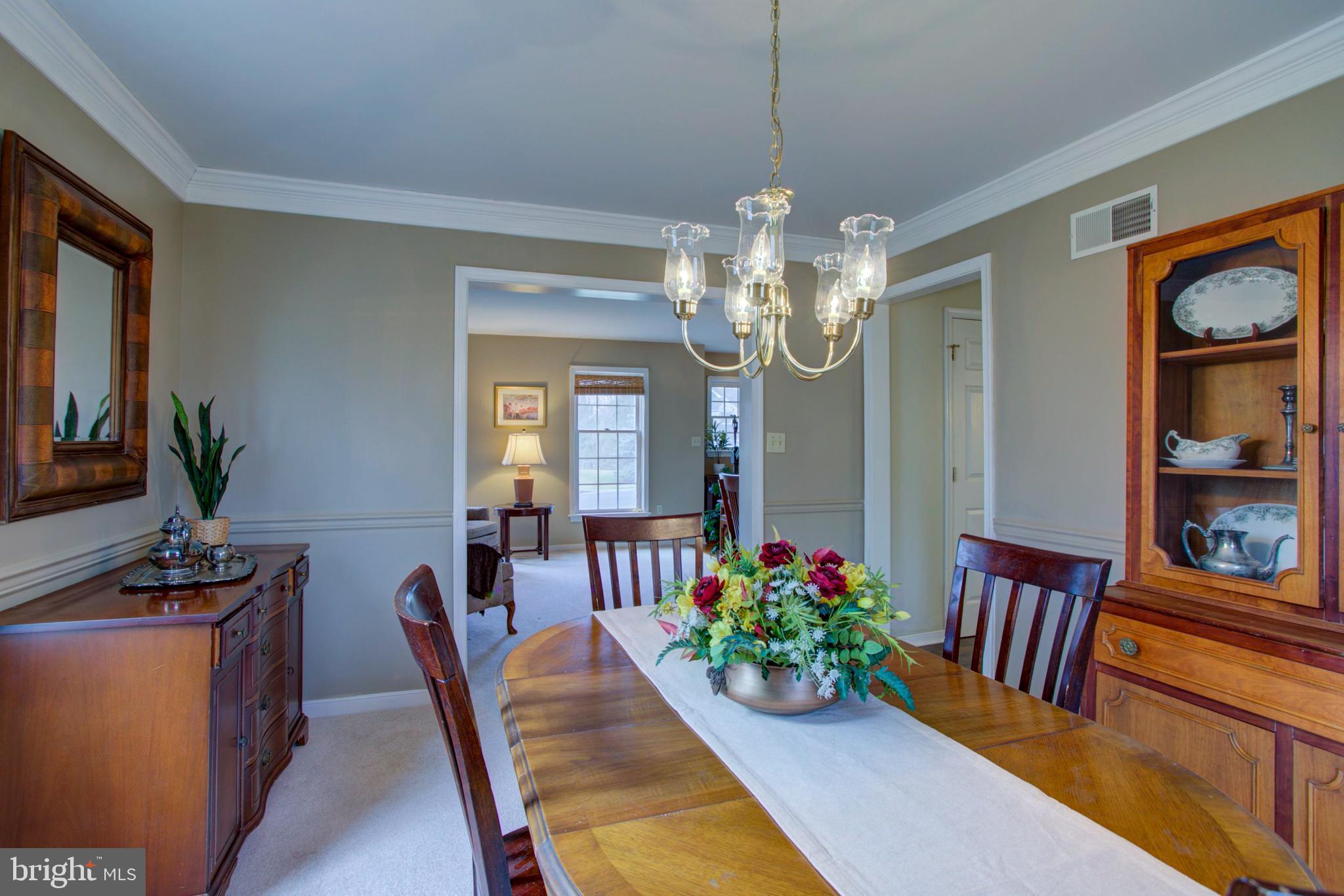 239 Kingsbridge Drive Lititz, PA 17543 - Photo 15 of 37 a view of a dining room with furniture and a chandelier