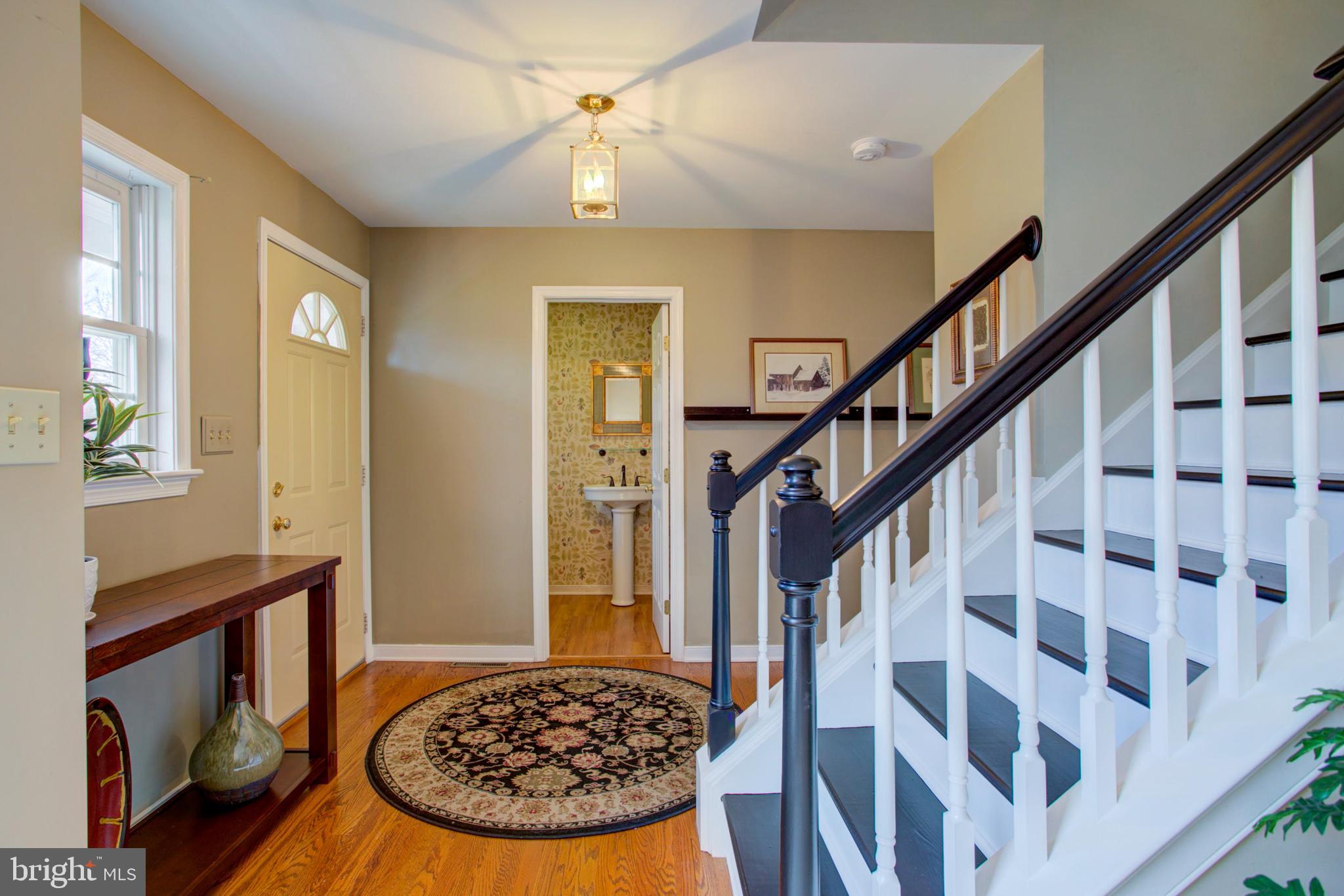 239 Kingsbridge Drive Lititz, PA 17543 - Photo 19 of 37 a view of a hallway with wooden floor and staircase