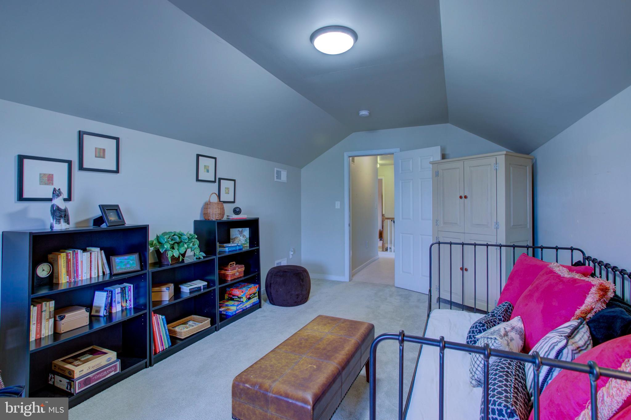 239 Kingsbridge Drive Lititz, PA 17543 - Photo 24 of 37 a living room with furniture cabinets and book shelf