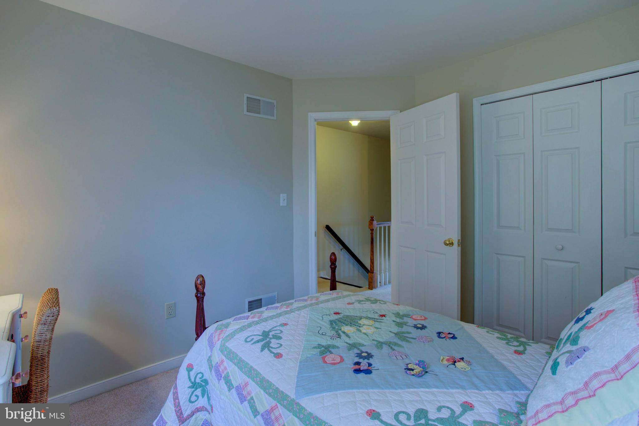 239 Kingsbridge Drive Lititz, PA 17543 - Photo 26 of 37 a bedroom with a bed and wooden floor