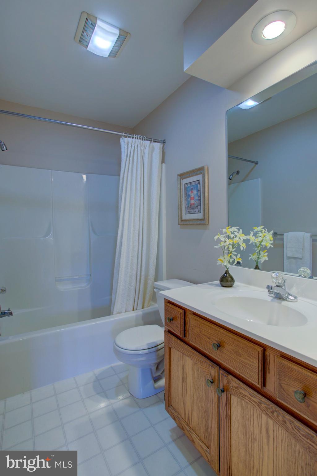 239 Kingsbridge Drive Lititz, PA 17543 - Photo 32 of 37 a bathroom with a sink a toilet and shower