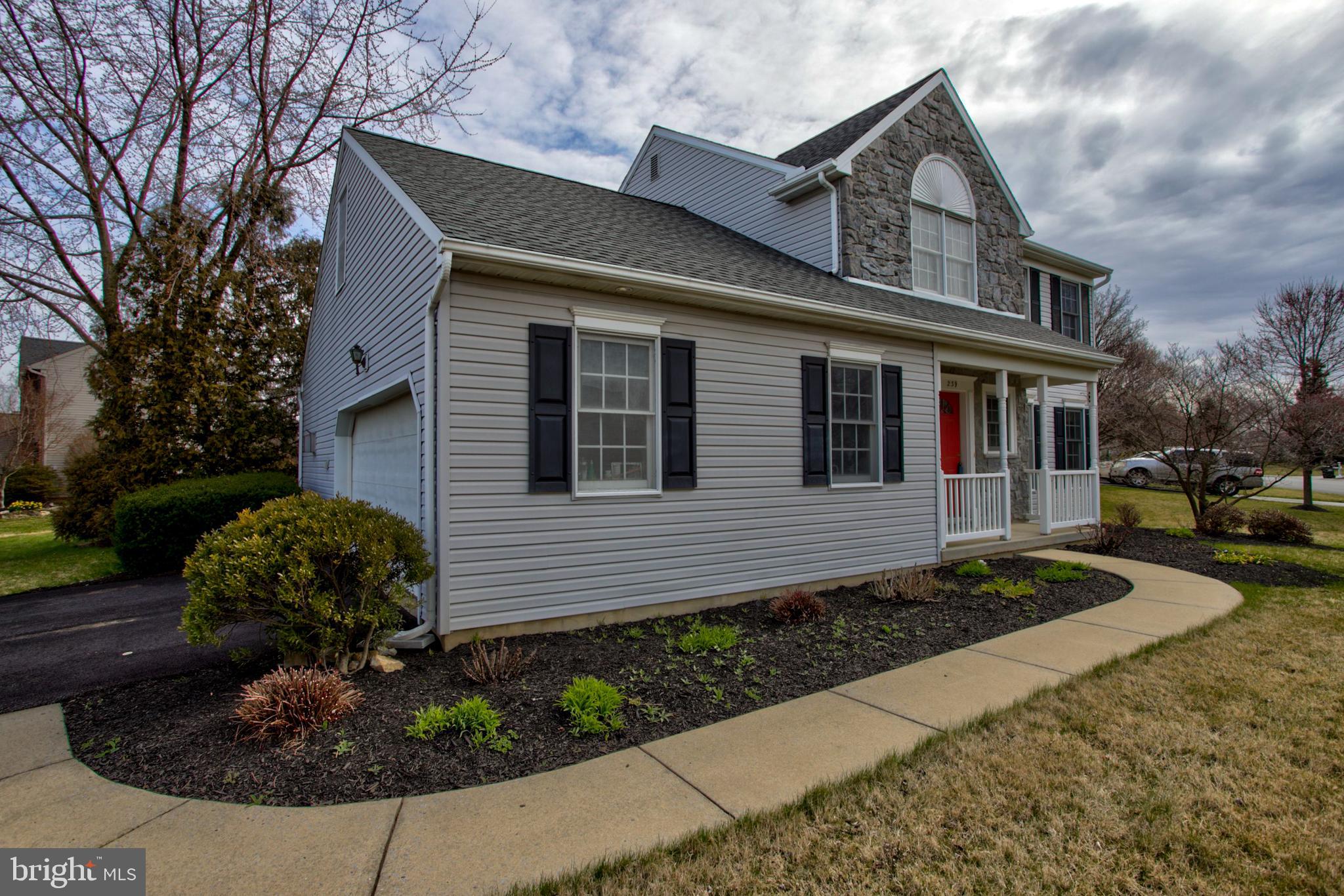 239 Kingsbridge Drive Lititz, PA 17543 - Photo 35 of 37 a front view of a house with garden