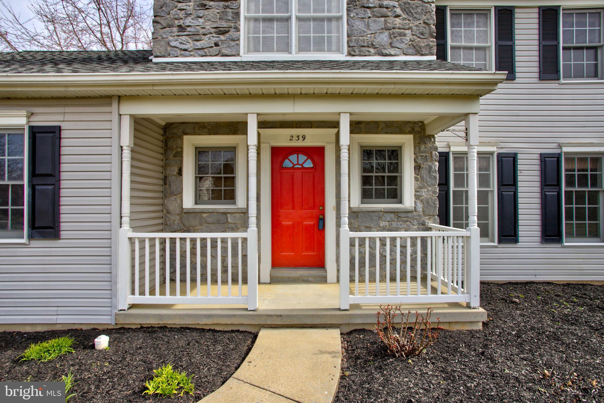 239 Kingsbridge Drive Lititz, PA 17543 - Photo 36 of 37 a view of a house with a small deck and a chair