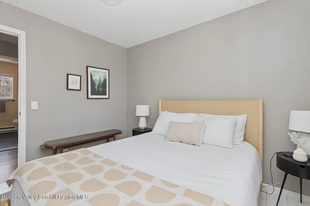 a bedroom with a bed and a table in it