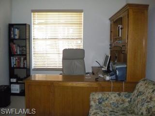 20281 Calice Court, Unit 2201 Estero, FL 33928 - Photo 4 of 8 a living room with furniture and a window