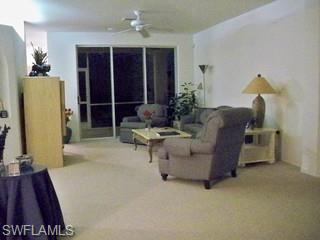 20281 Calice Court, Unit 2201 Estero, FL 33928 - Photo 5 of 8 a living room with furniture and a rug