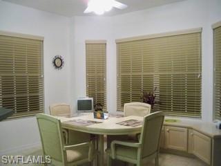 20281 Calice Court, Unit 2201 Estero, FL 33928 - Photo 6 of 8 a view of a dining room with furniture and window